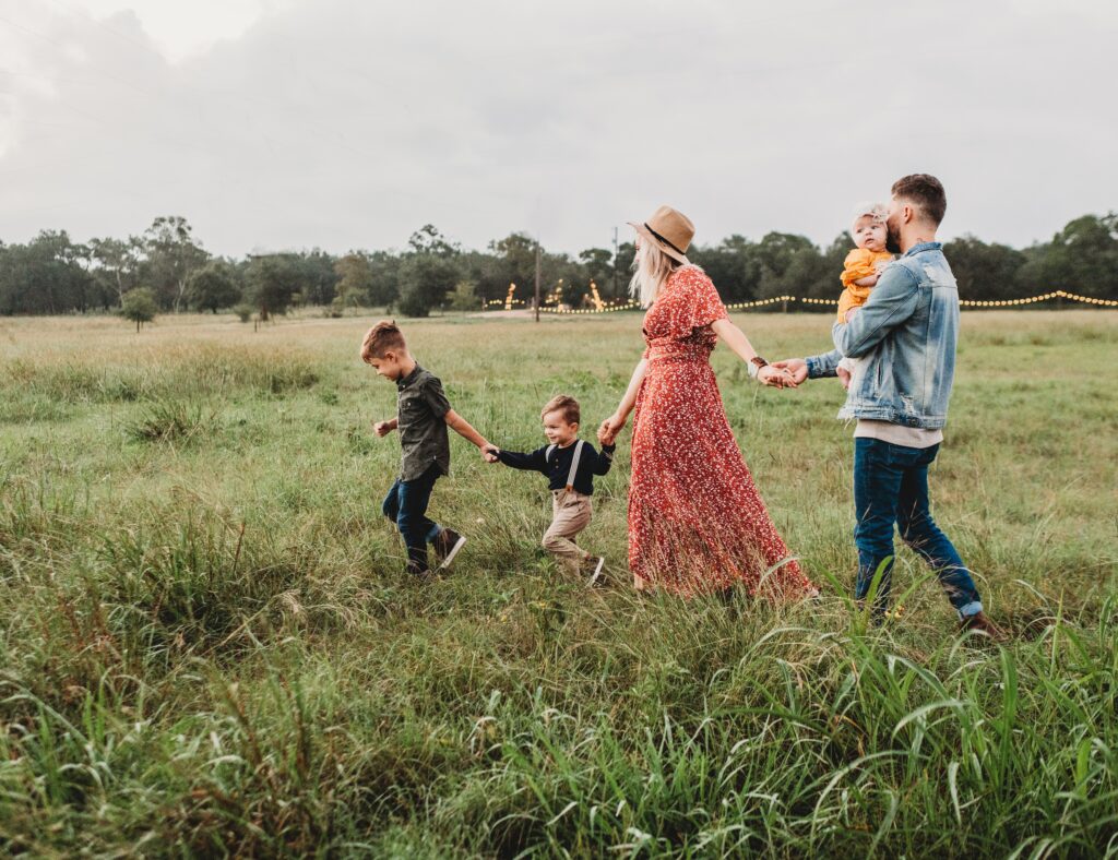 family walking on the field image