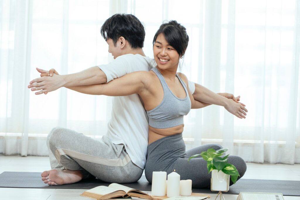 happy-man-and-woman-doing-acro-yoga image