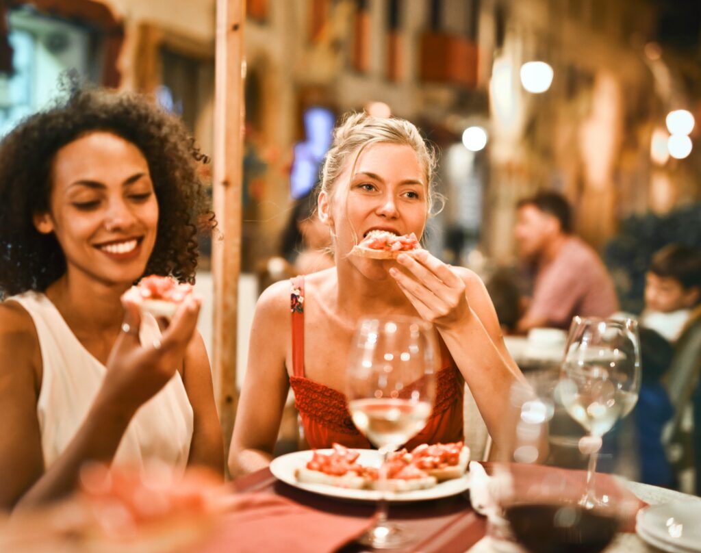 Woman eating bruschetta image