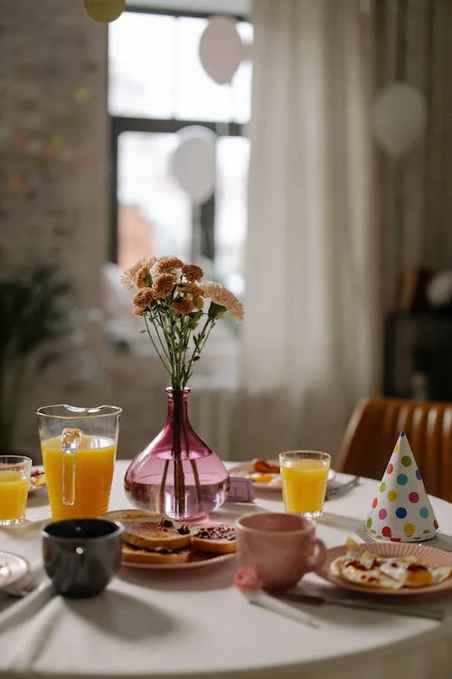 A birthday breakfast set up on a table