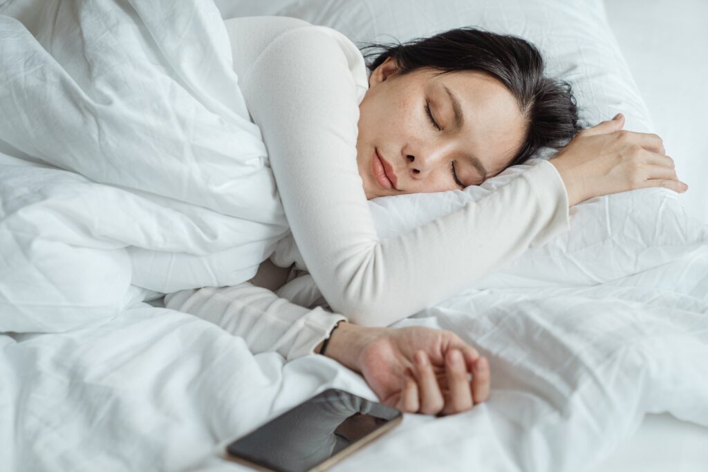 woman sleeping using a pressure blanket image