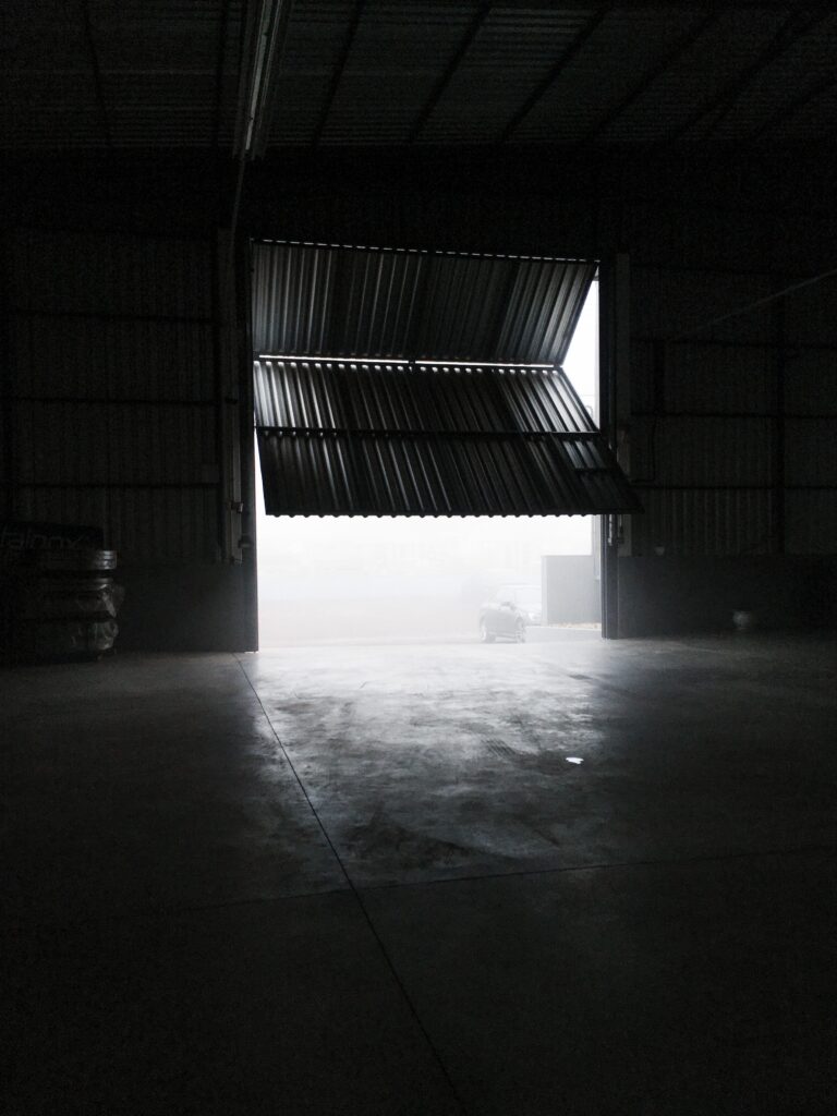 spacious garage with metal panel image
