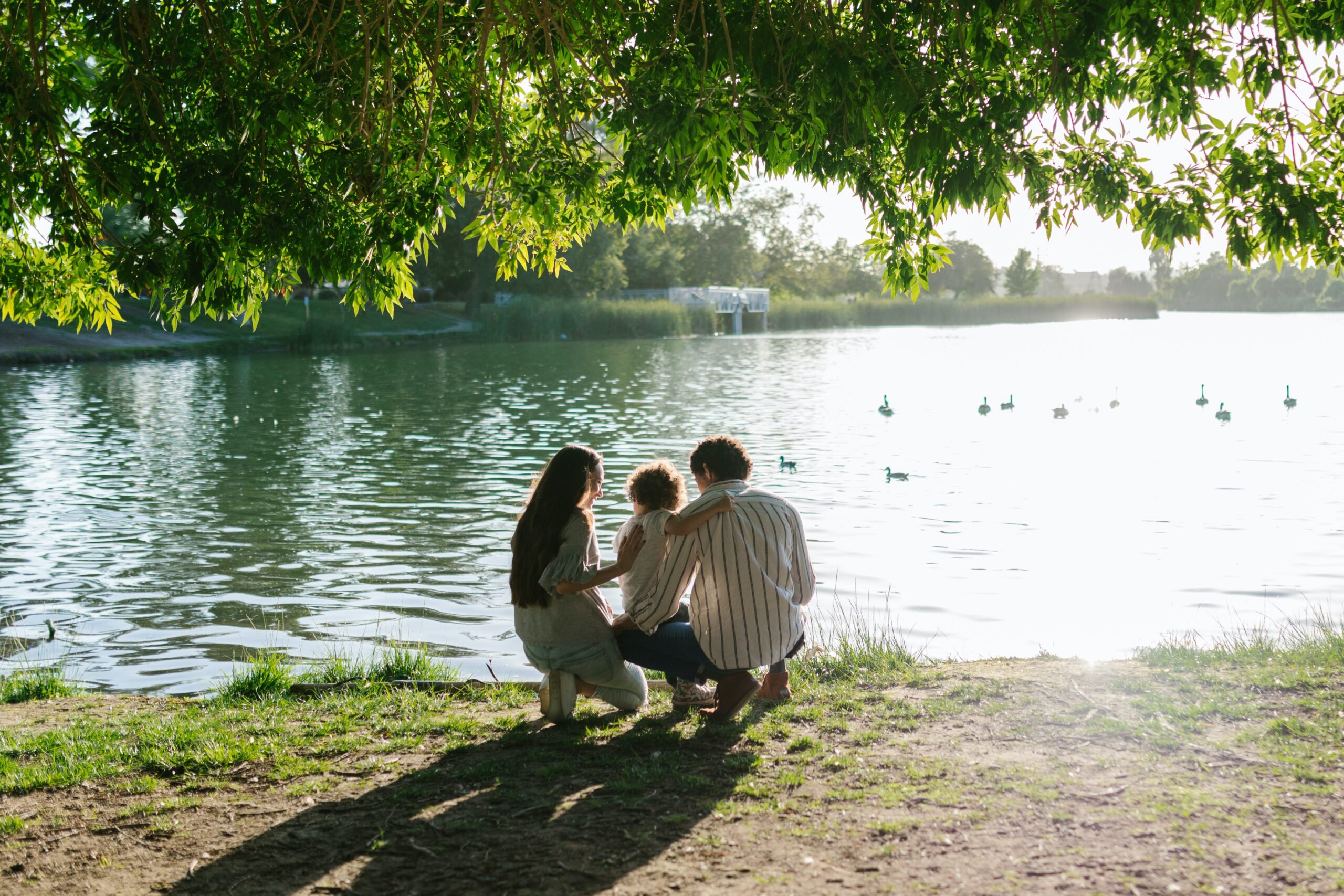 A family near a lake image