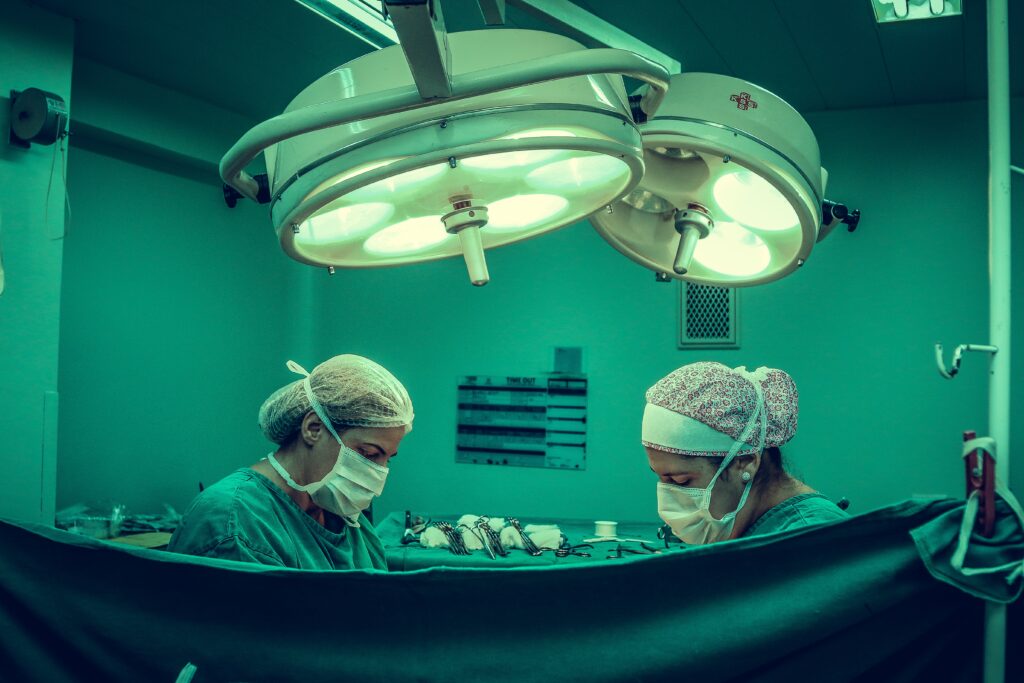 Two surgeons doing surgery image