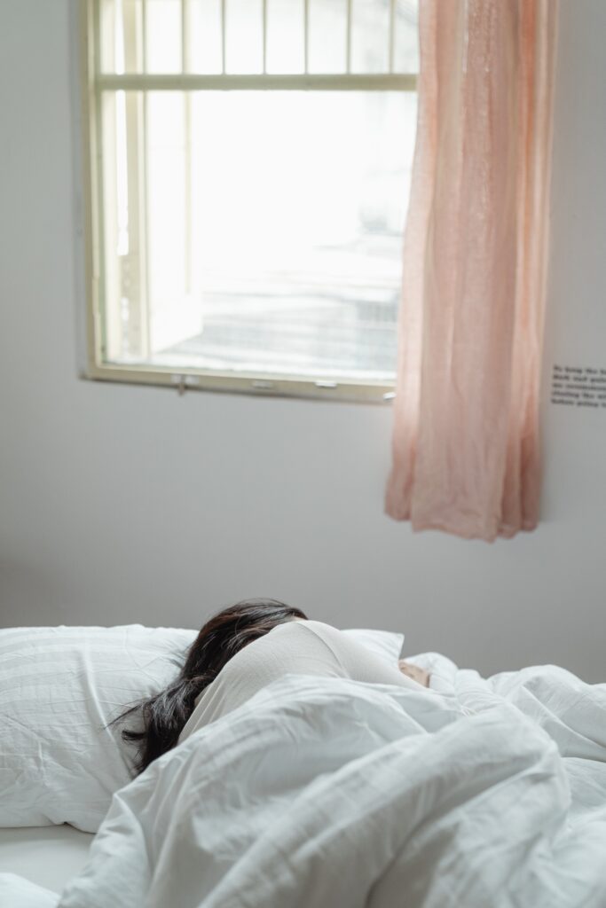 A woman asleep during the day image