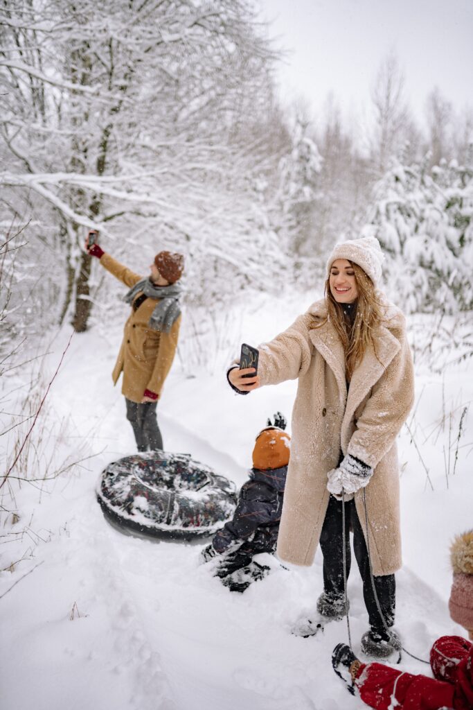 family sledding with their kids image