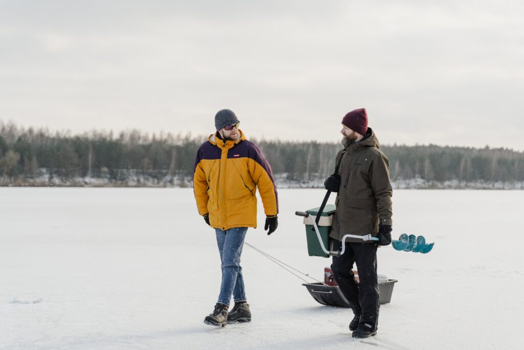 men walking in frozen lake image