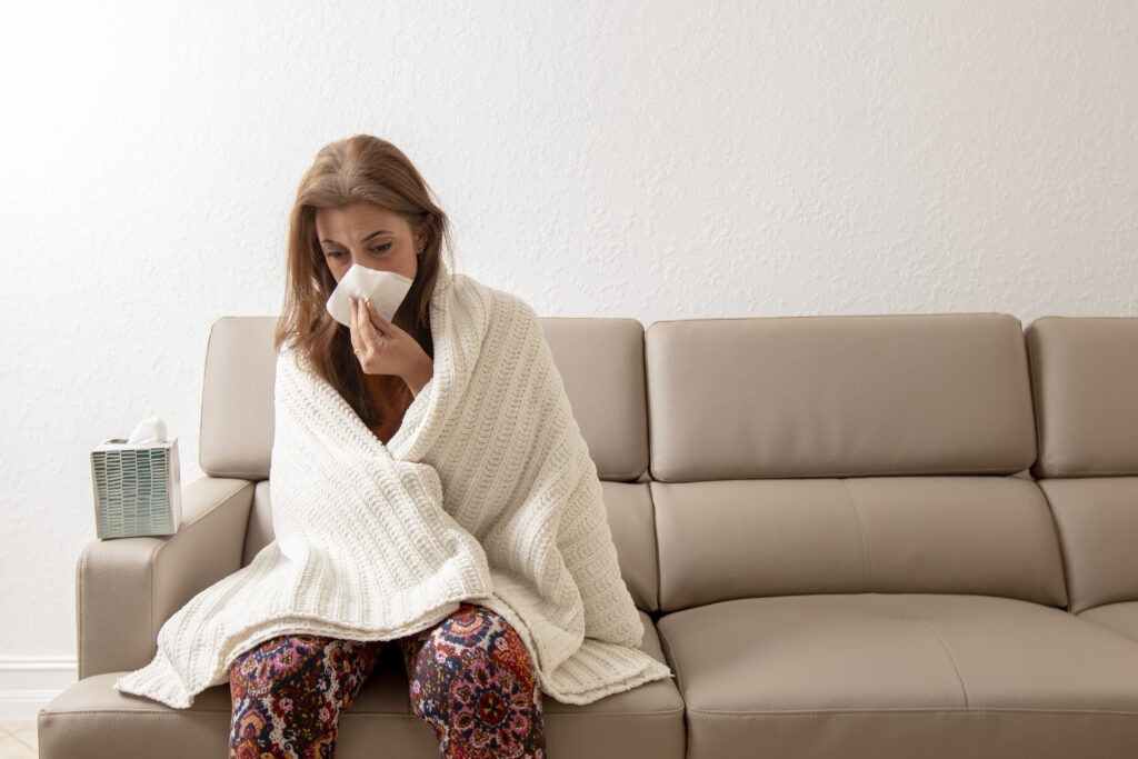 Sick woman on couch image