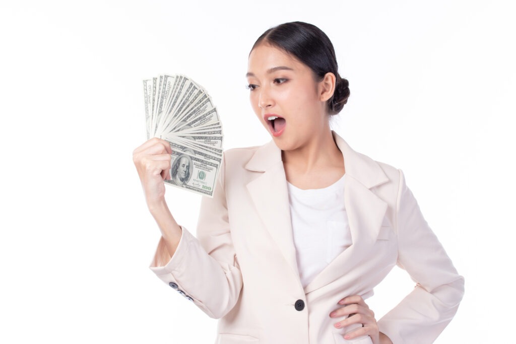 woman-in-suit-holding-dollar image
