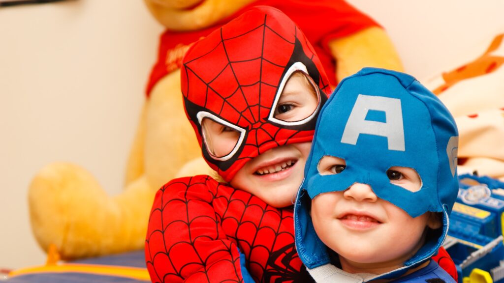 Children’s in Superhero costume attending a superhero-themed party