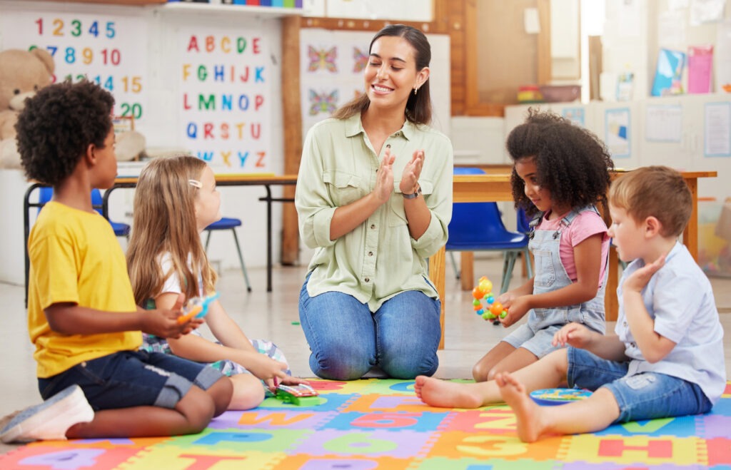 teacher-singing-with-her-preschool-children image