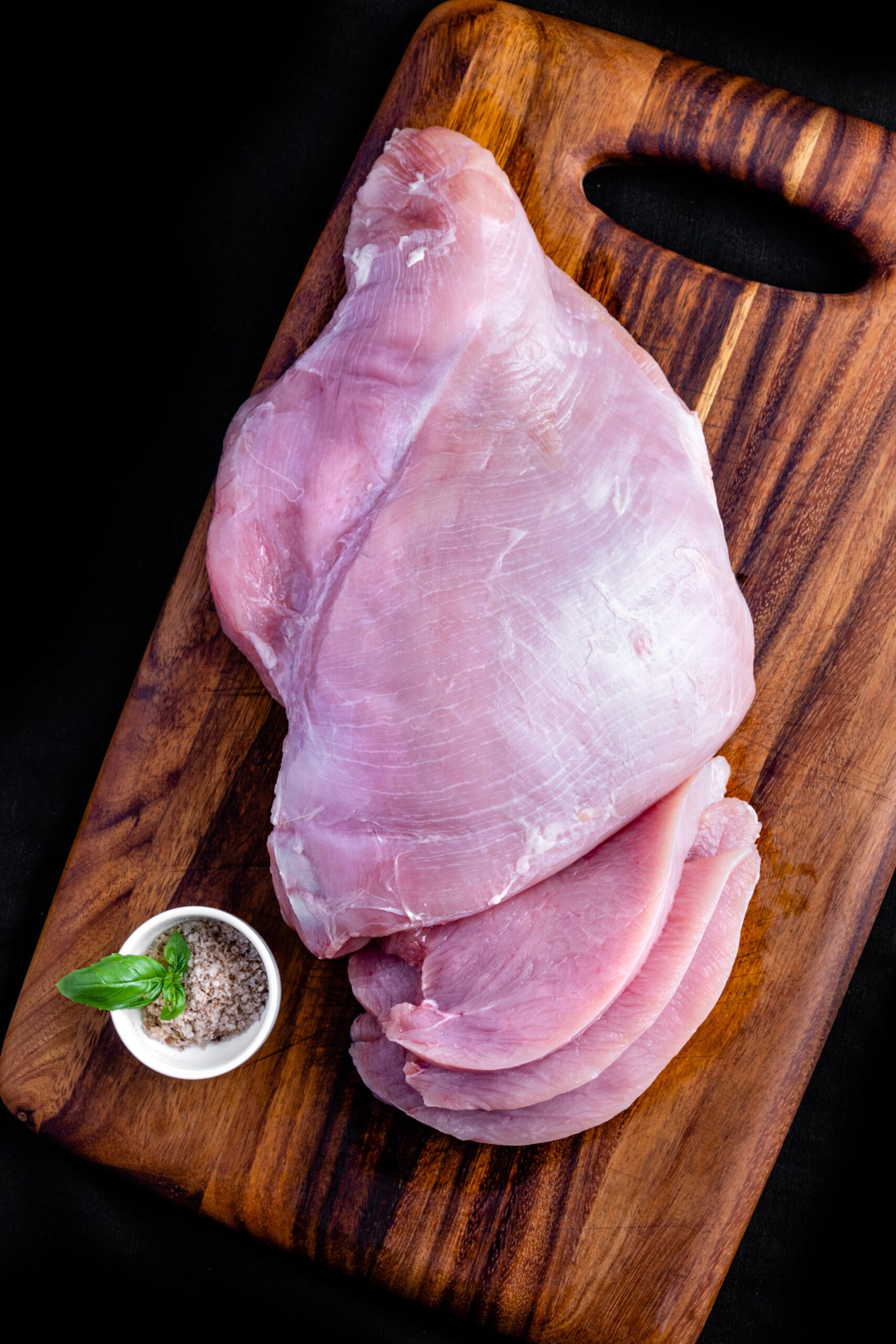 chicken meat on a chopping board