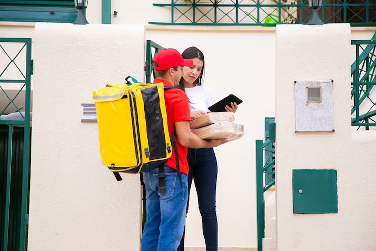 Woman receiving a package at home