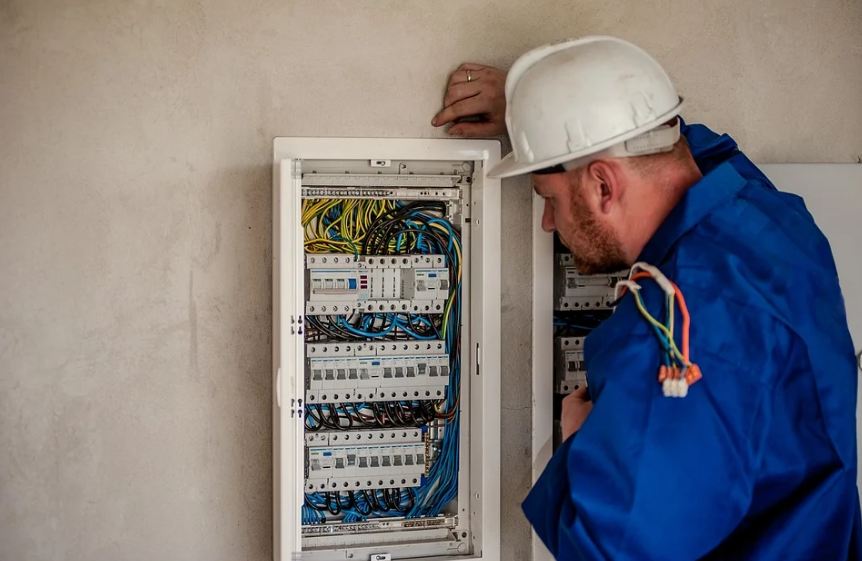 electrician looking at wirings