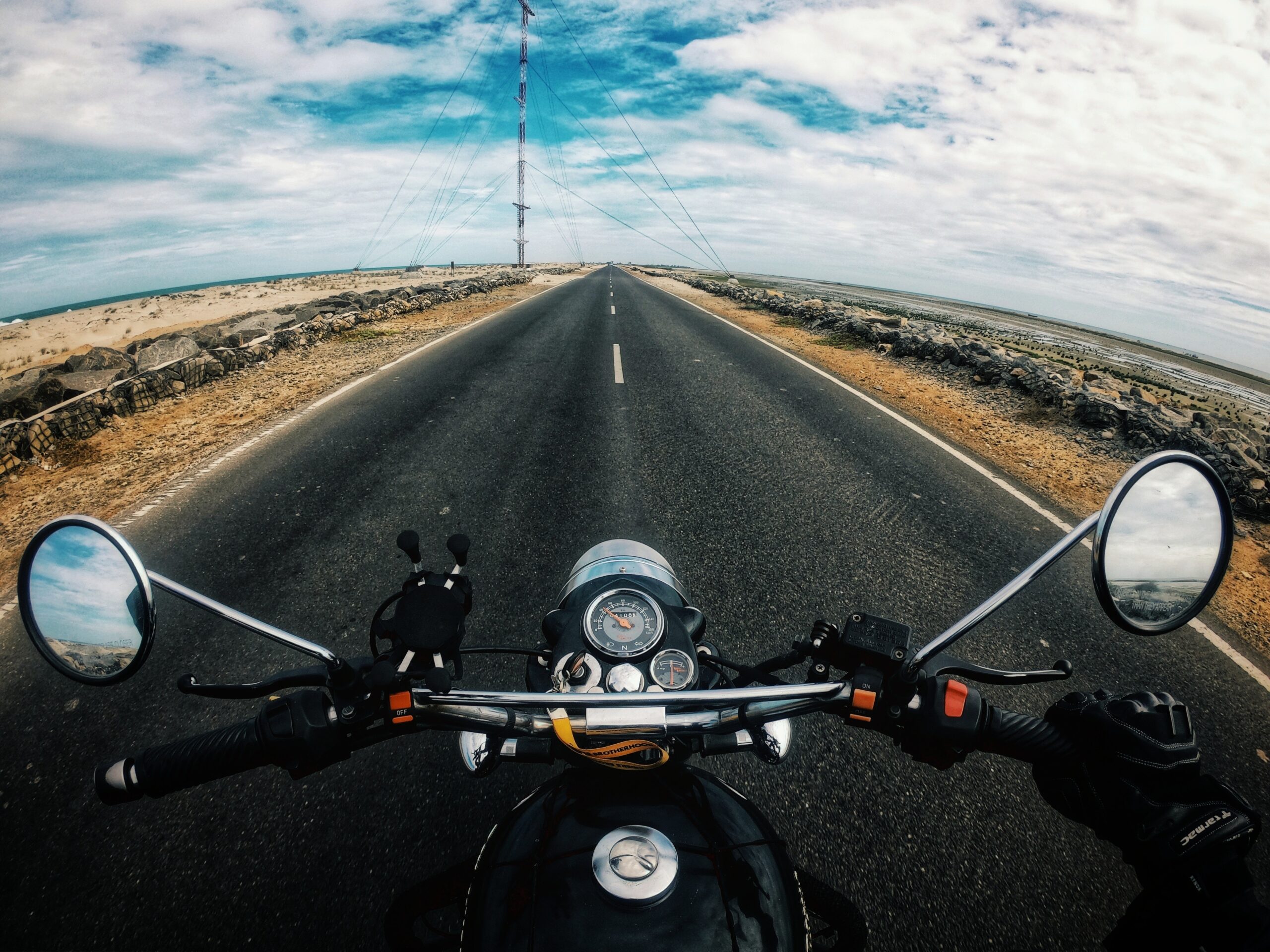 Riding a motorcycle on a highway image