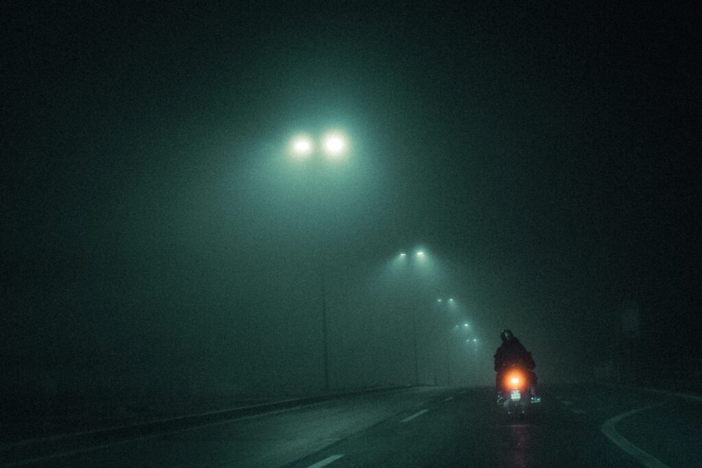 Riding motorcycle at night image