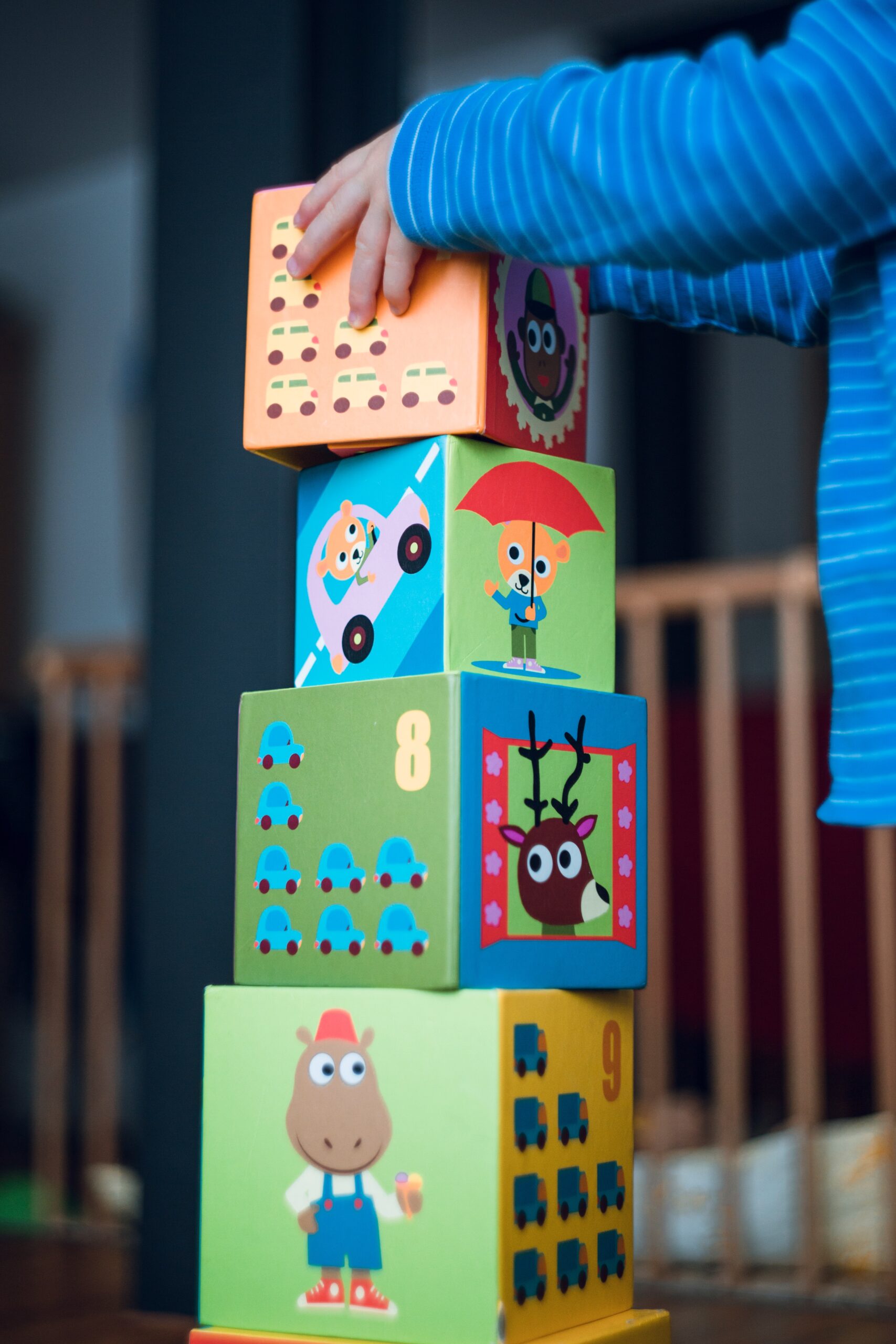 A child stacking blocks on top of each other image
