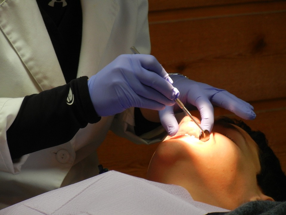 A dentist treating a patient image