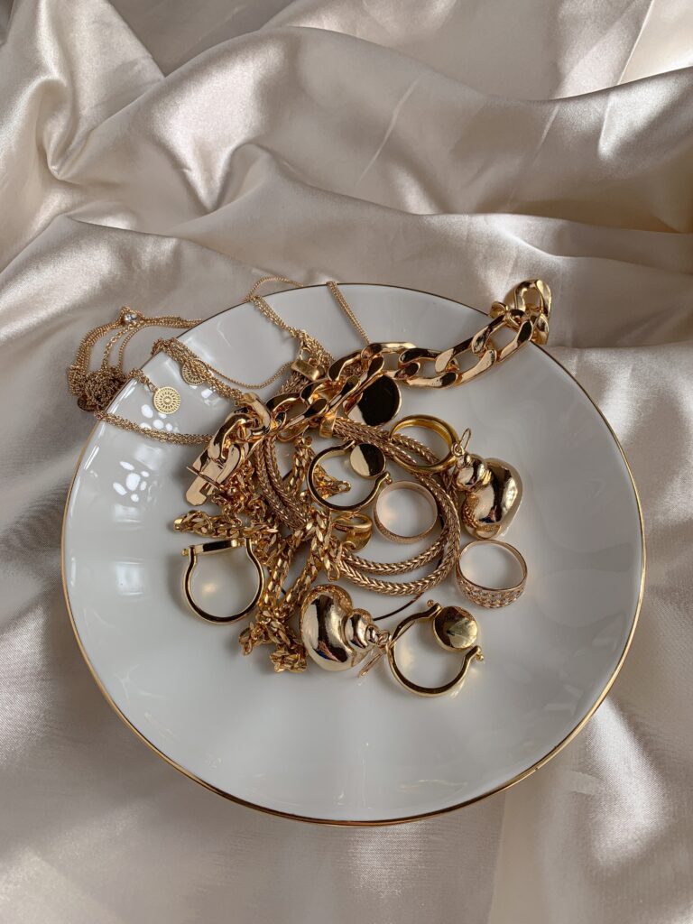 Gold accessories on White Saucer