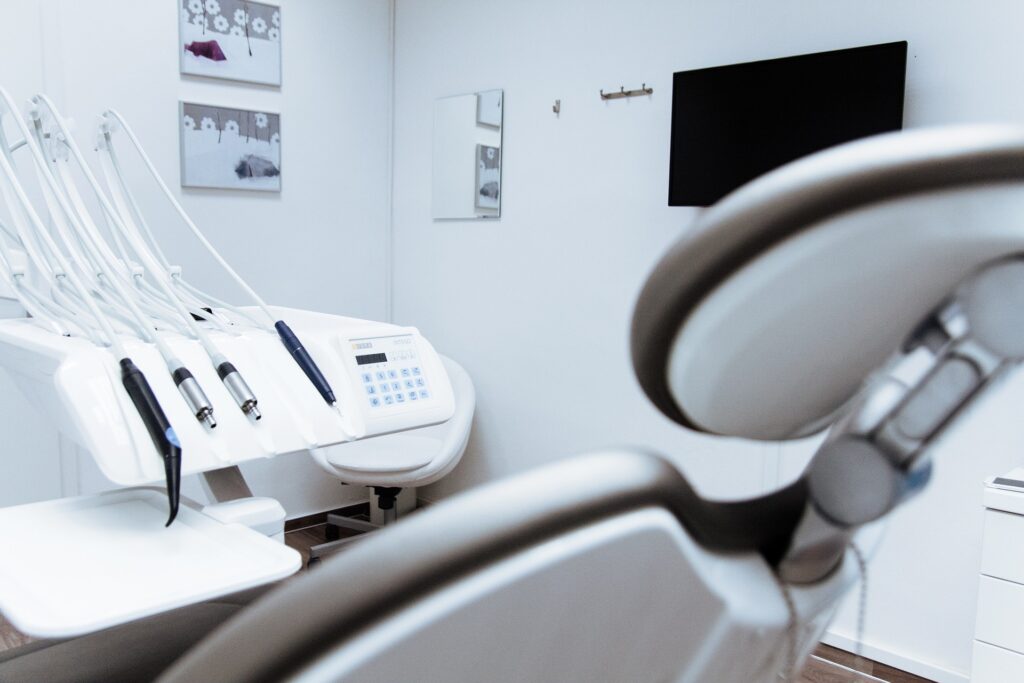 an image of a dental clinic with a chair and special dental tools