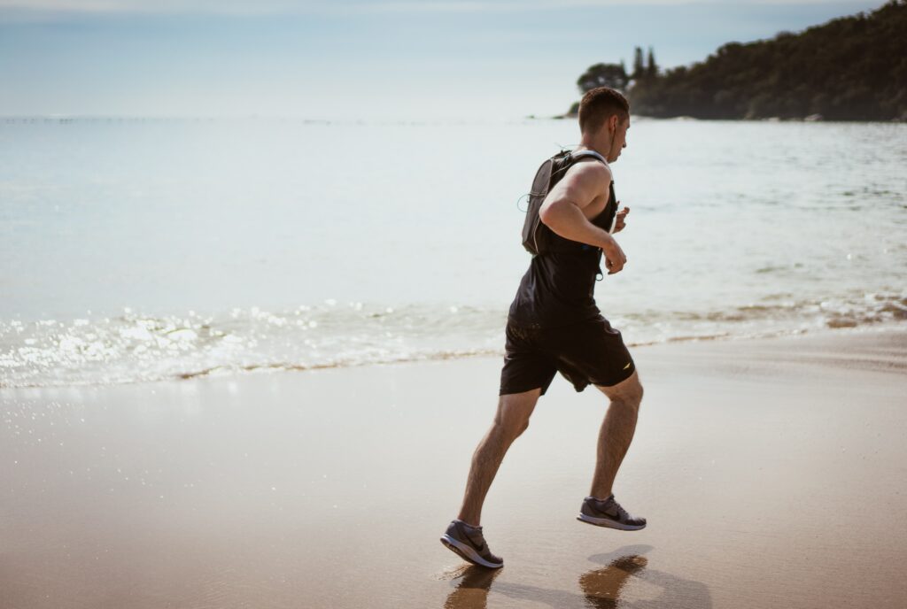A man jogging on the beach