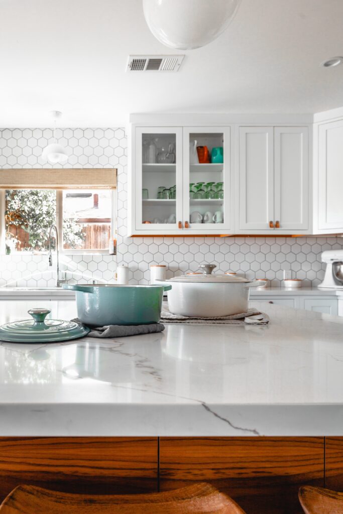 marble kitchen countertops with white color, with 2 casseroles on top image