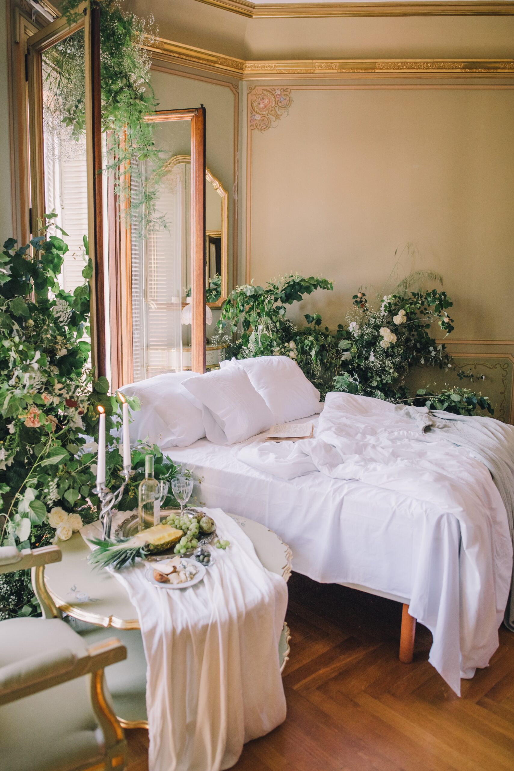 A bed surrounded with plants