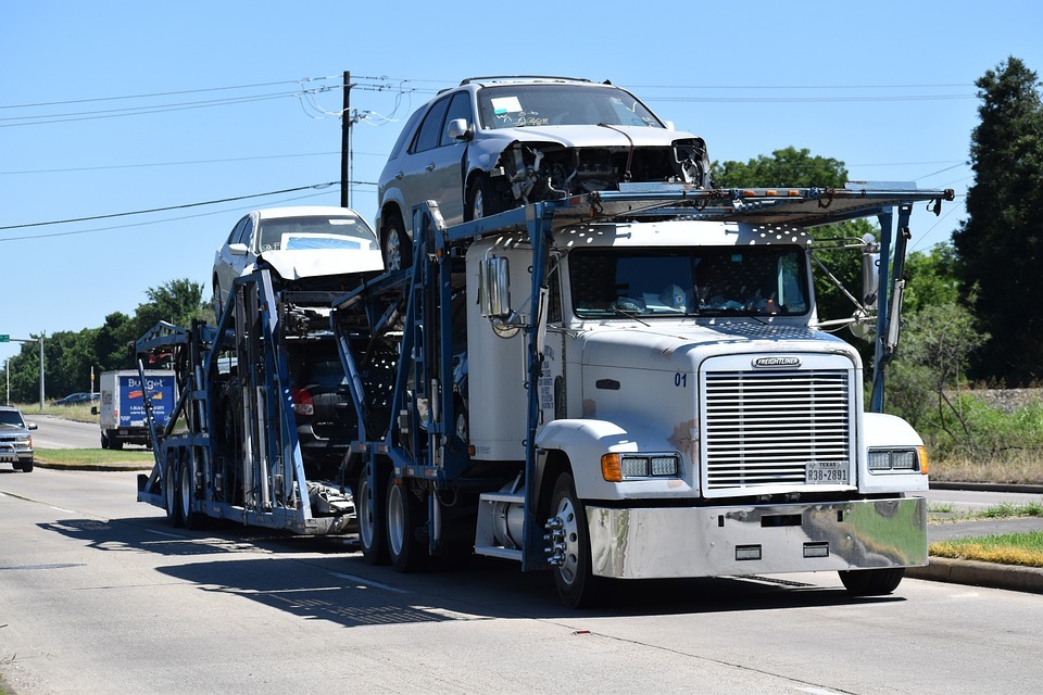 A truck transporting a car image