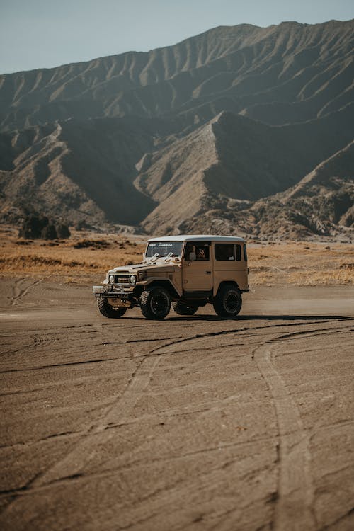 A white jeep in a desert