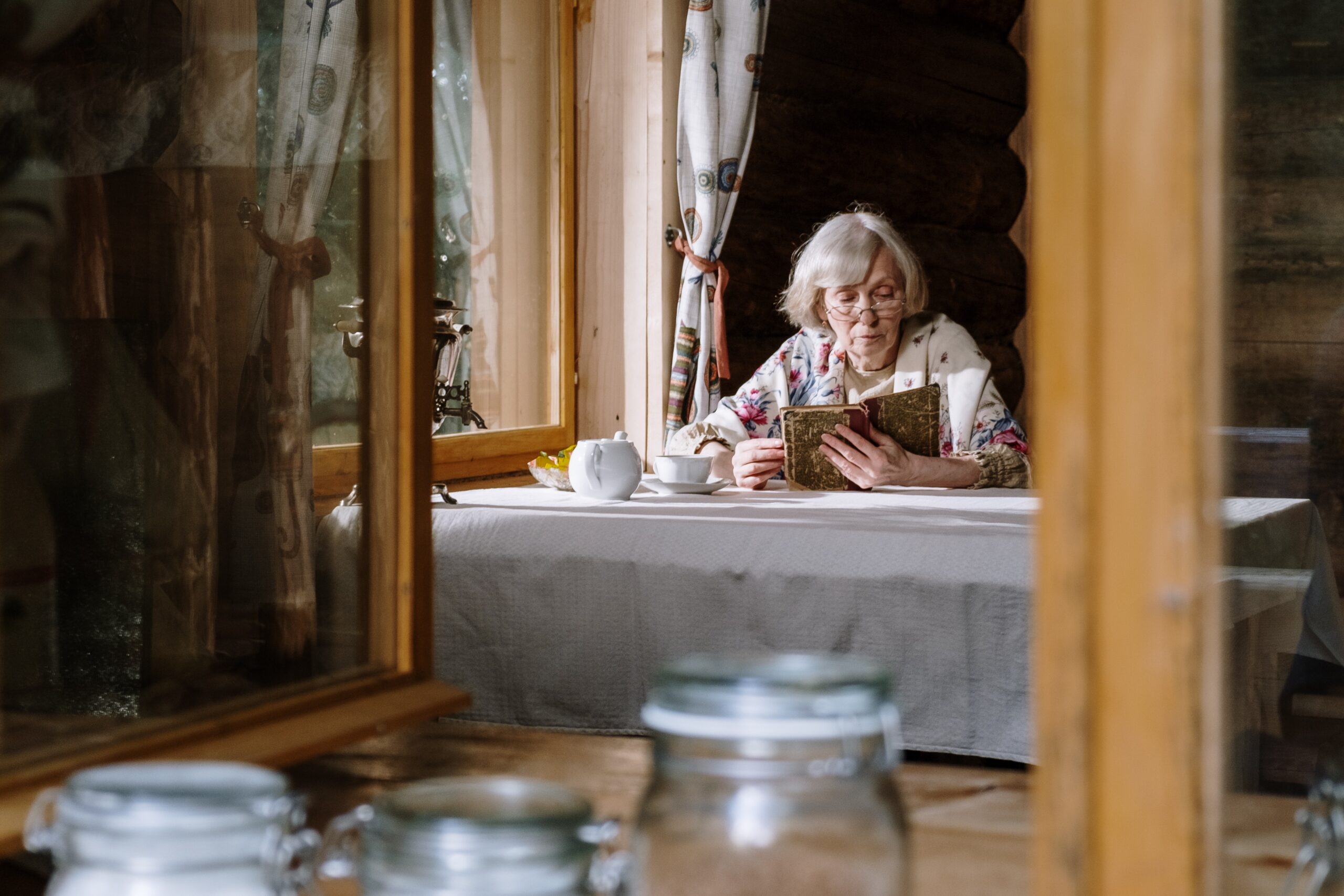 An elderly woman reading a book image