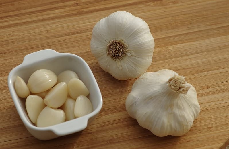 Garlic on a brown wooden table