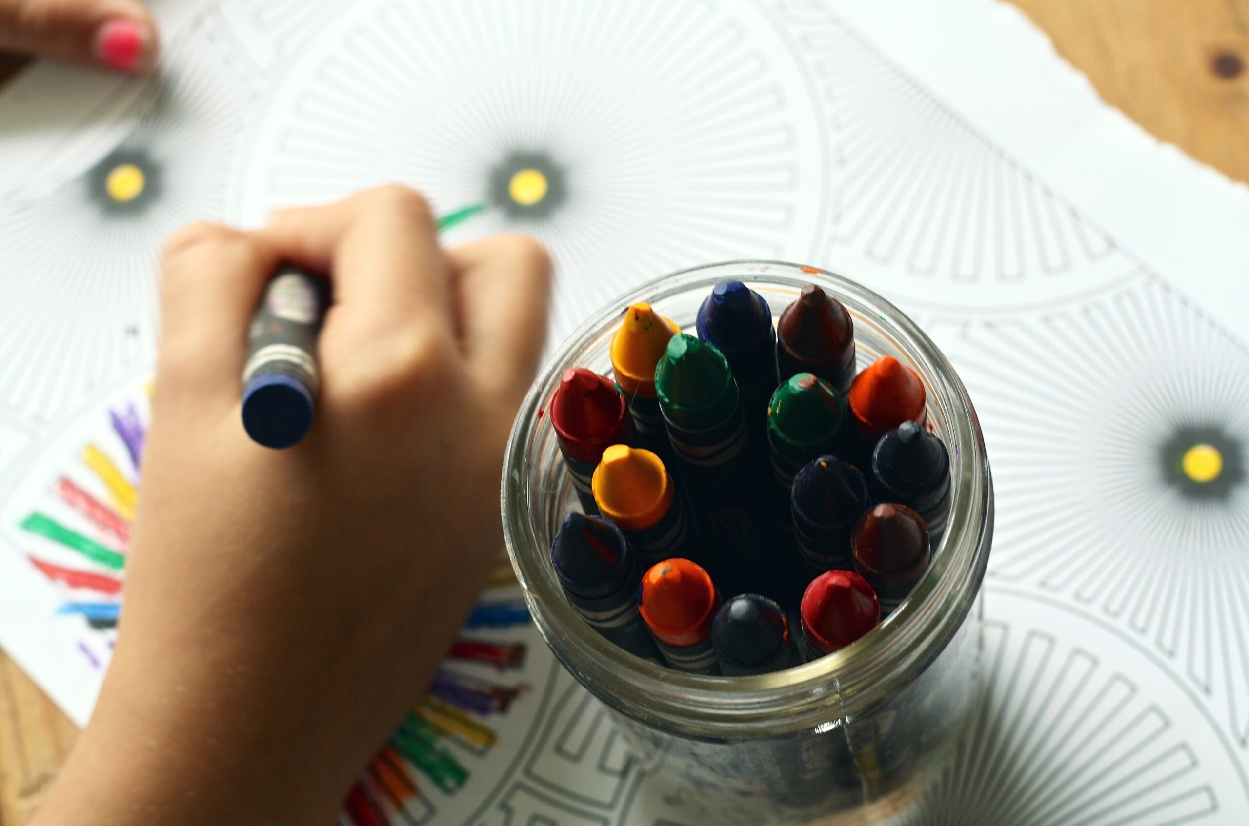Person coloring art with crayons image