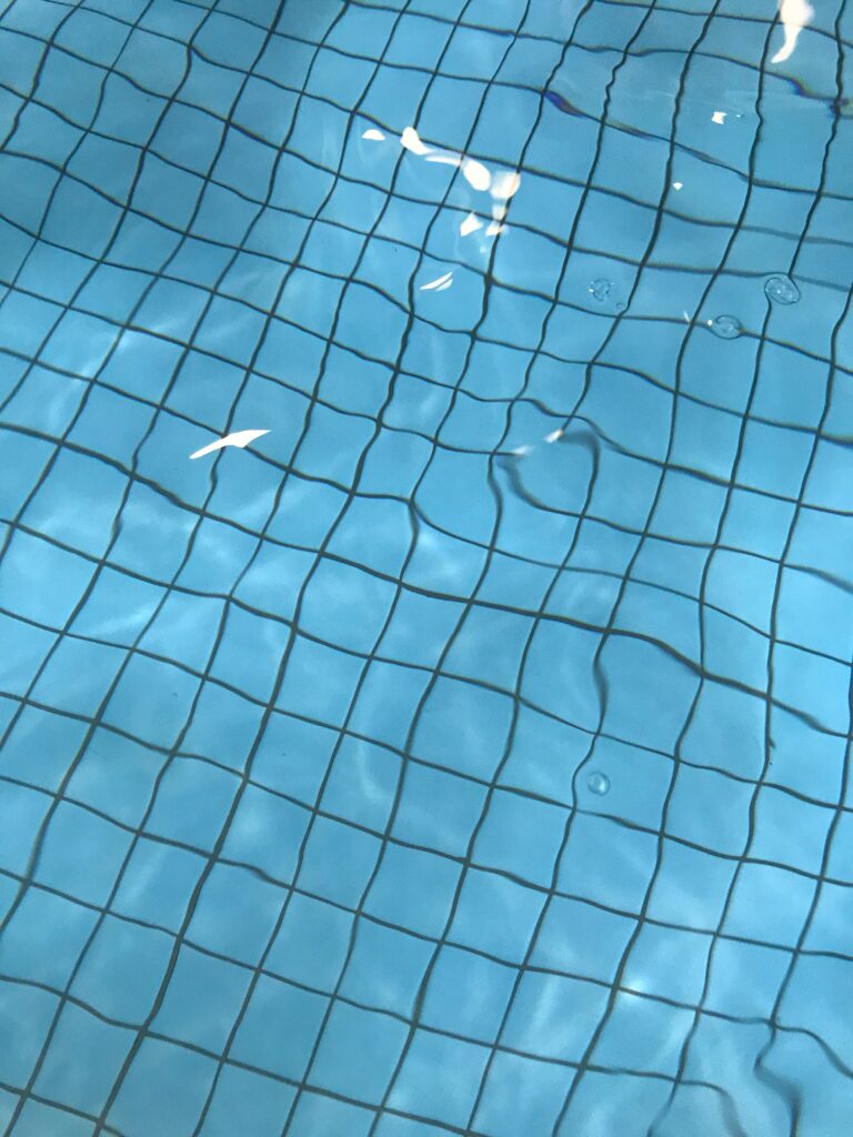 Swimming pool with water and blue bottom image