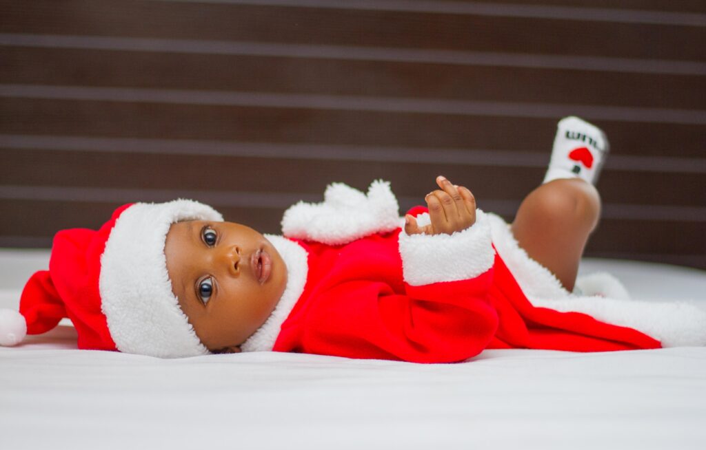 baby wearing a santa costume image