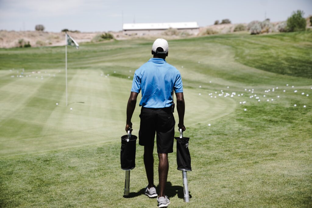 carrying bags in a golf field image