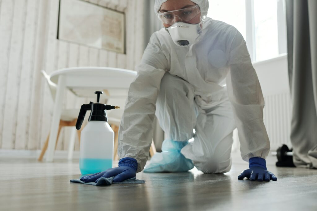 woman cleaning a spill on the floor image