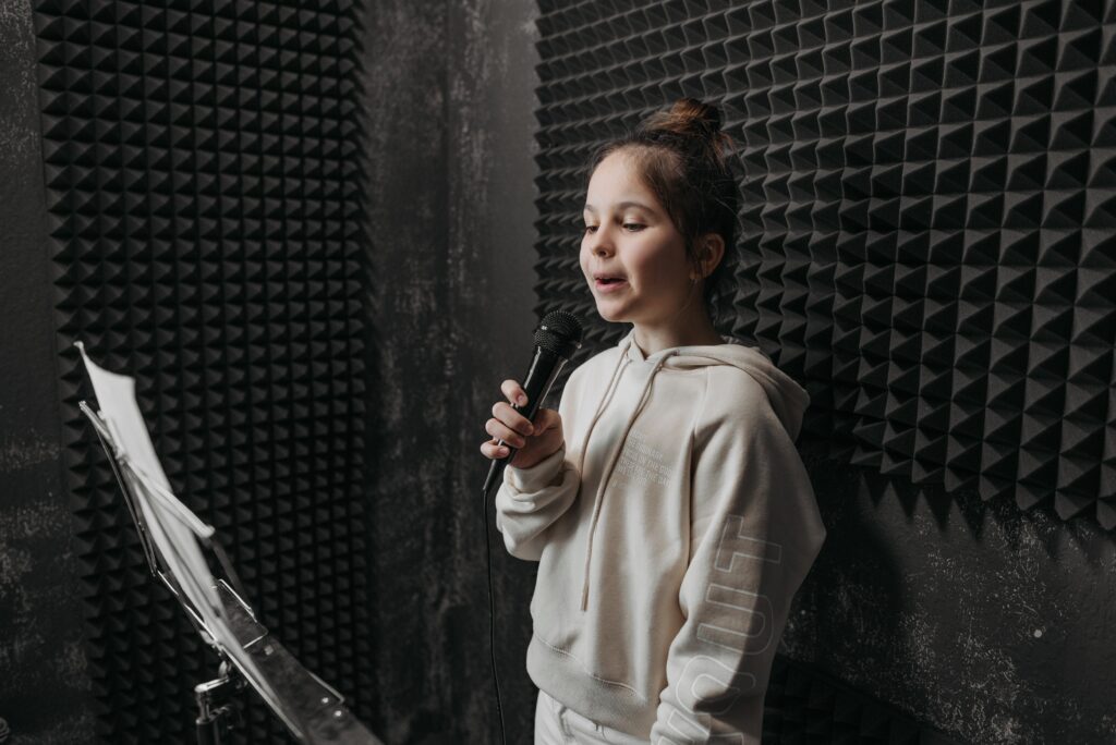 A girl singing a soundproof room image