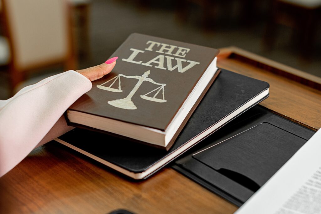 A person holding a law book image