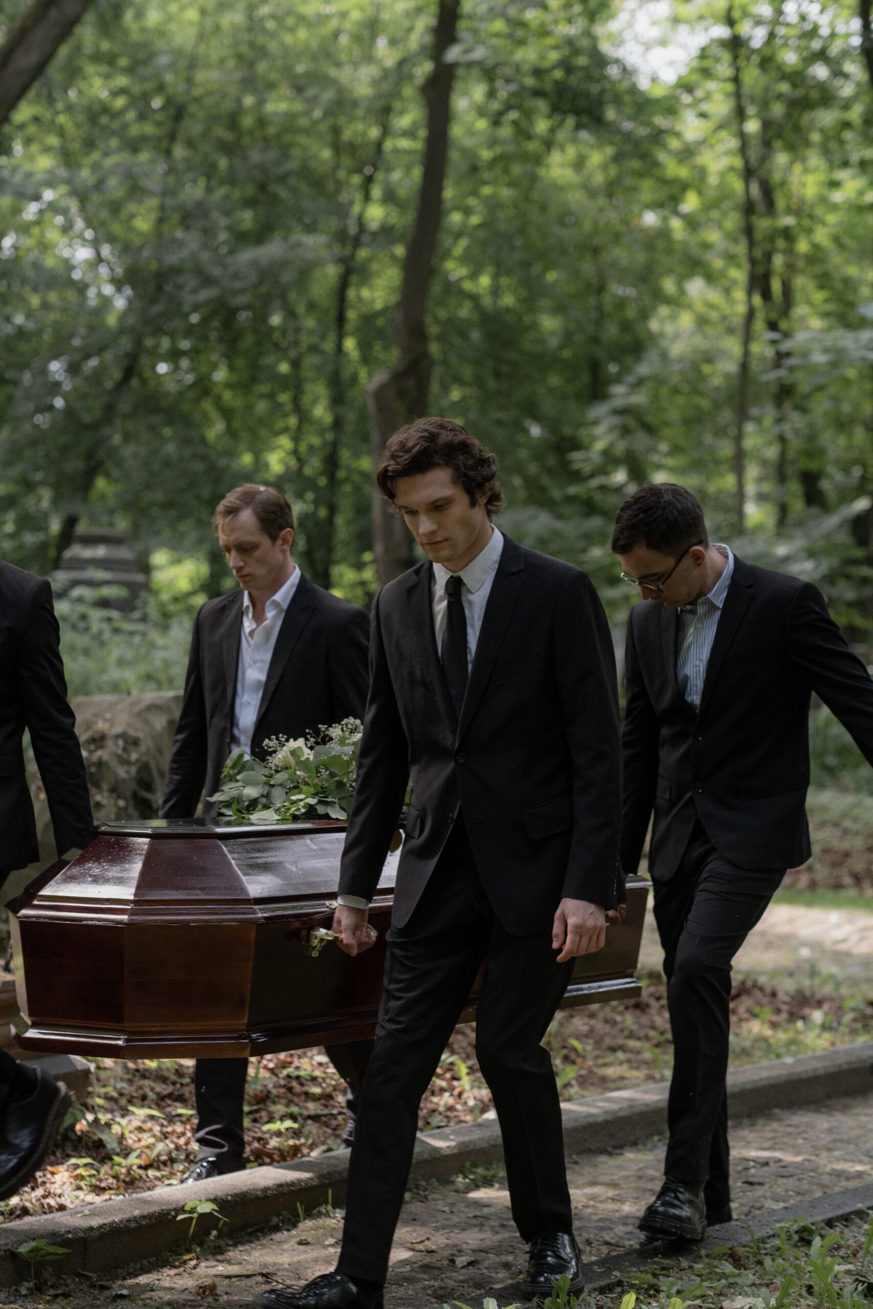 Four men carrying a casket image