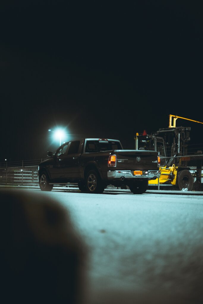 A black pickup truck in a parking lot