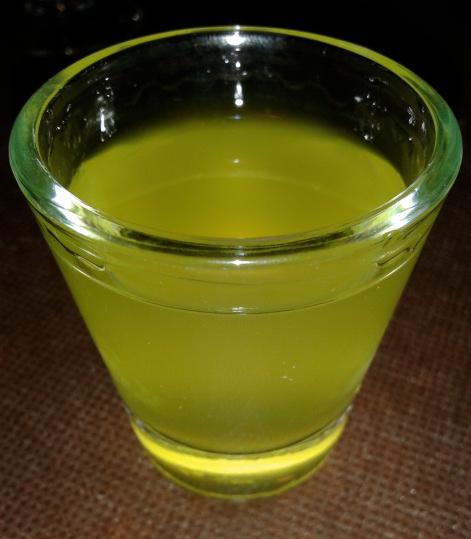 A shot glass of limoncello