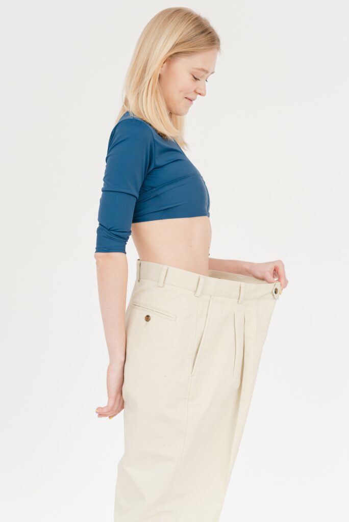 A woman wearing oversized pants image