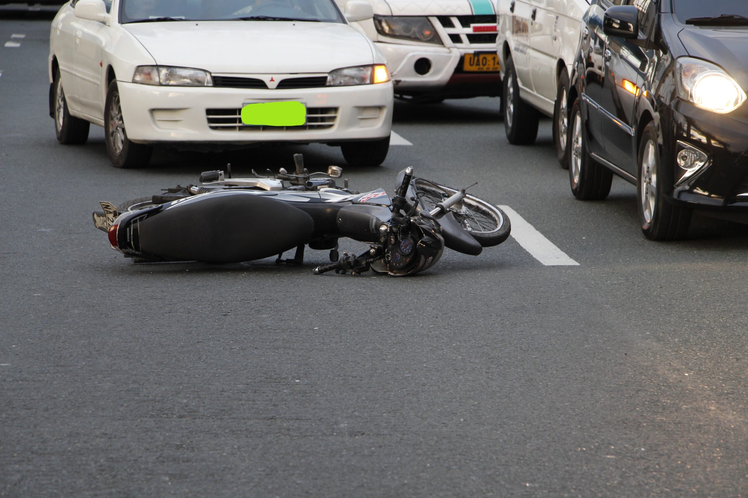 Motorcycle lying on the road after an accident image