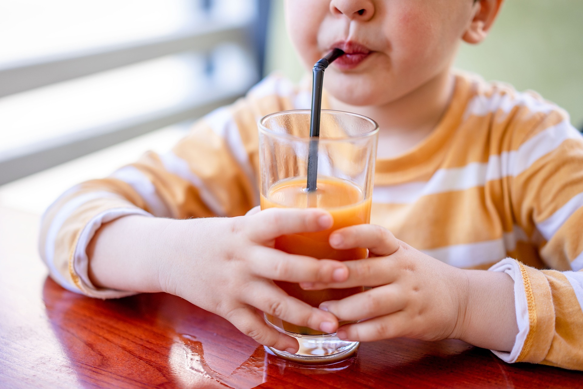 A child drinking a juice