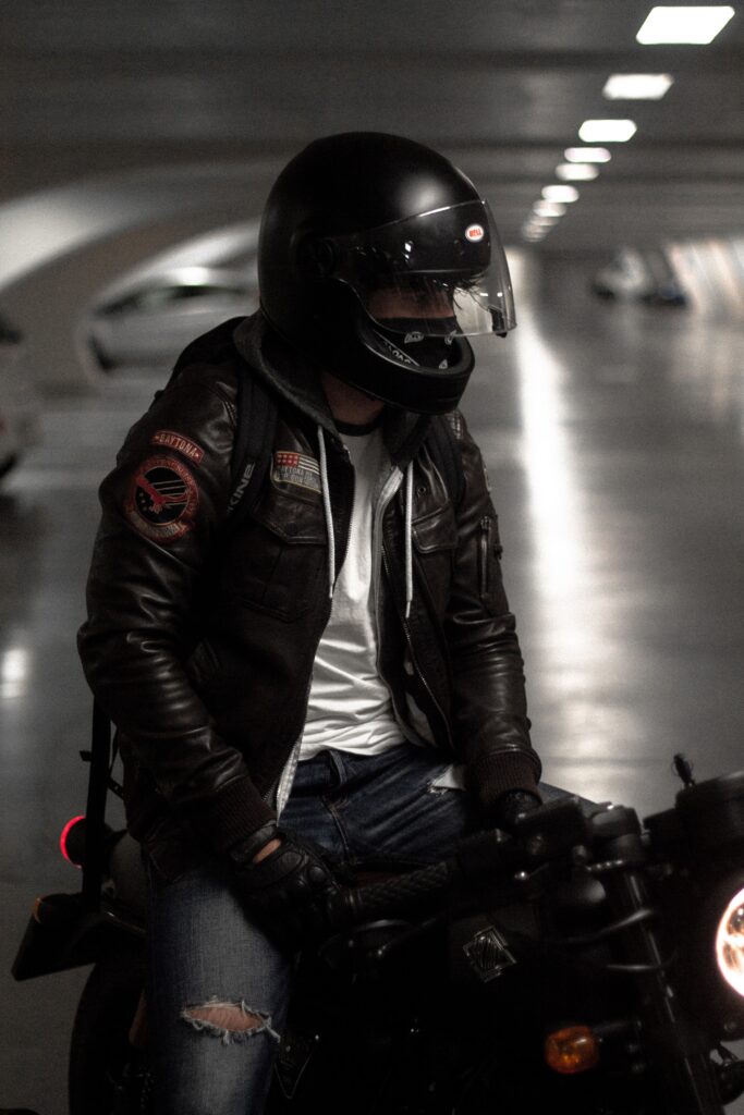 man sitting on motorbike in modern parking image