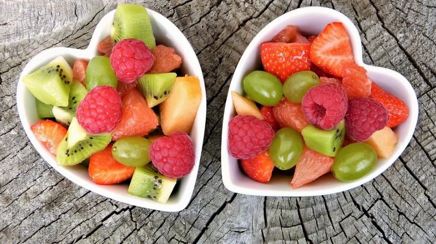two bowls of assorted, diced fruit