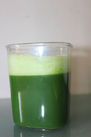 A glass of wheatgrass juice image