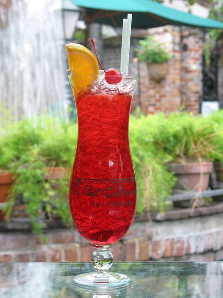 Hurricane cocktail in a Souvenir Hurricane Glass at Pat O'Brien's Bar in New Orleans