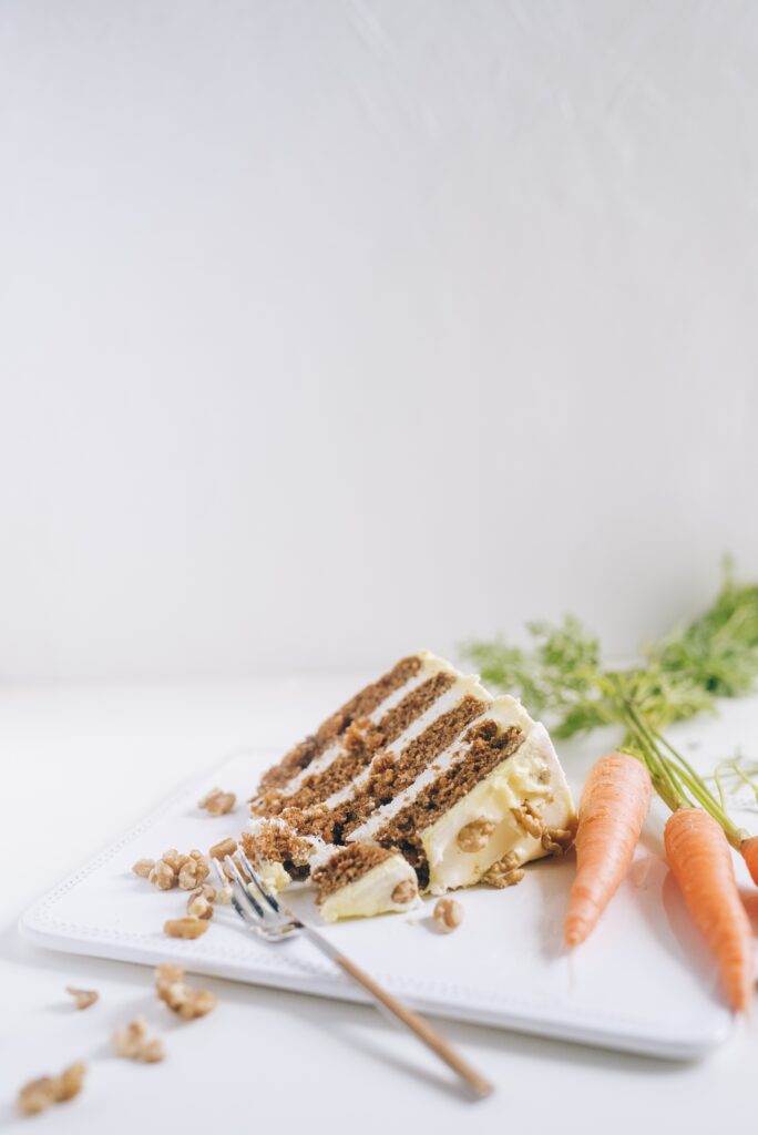 Sliced carrot cake on a white plate image