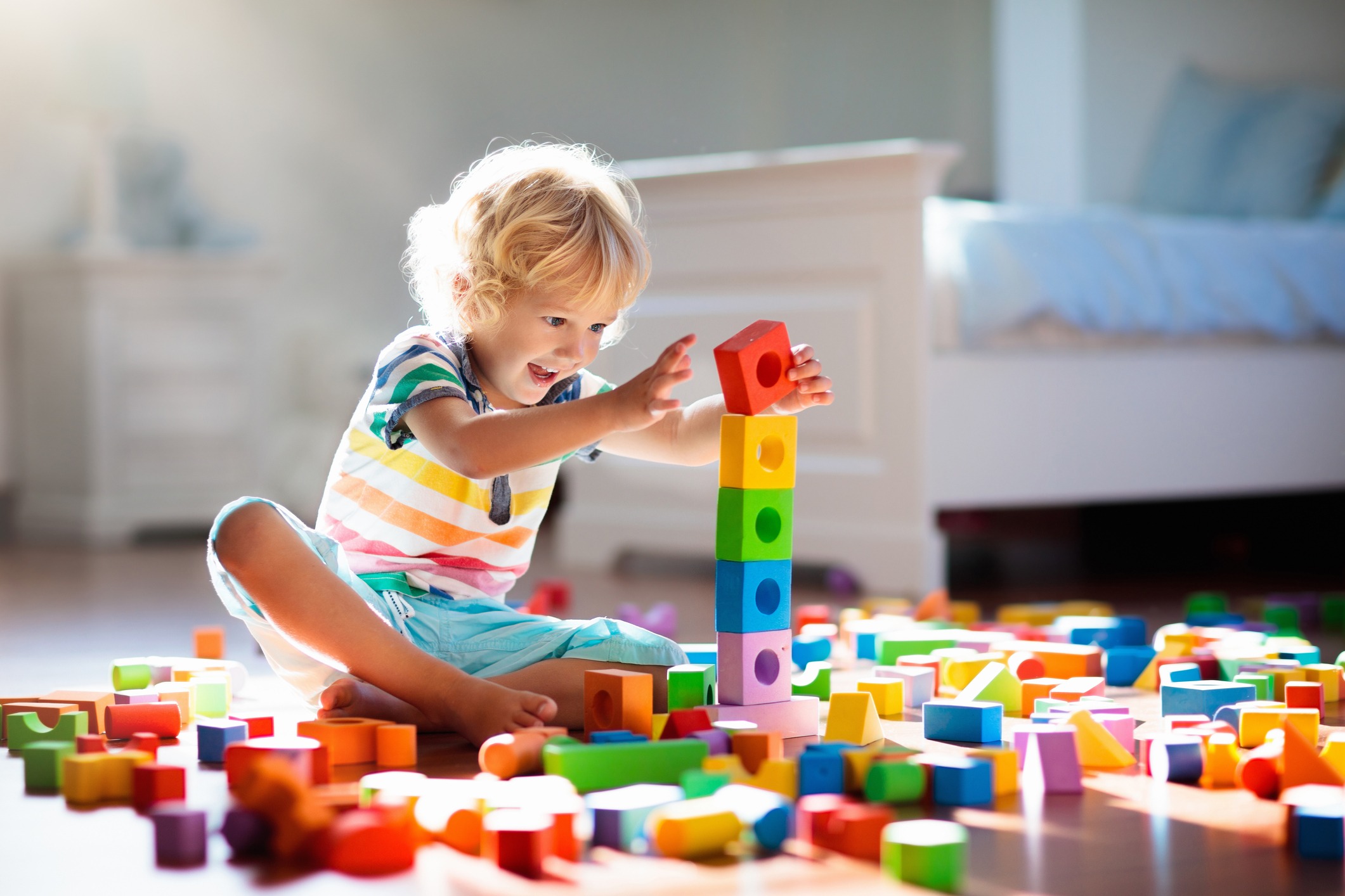 child-playing-with-colorful-toy-blocks image